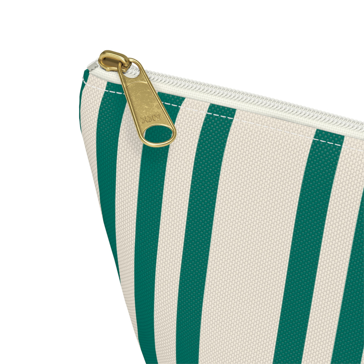 Close-up of the emerald green and cream stripes and gold zipper pull on the makeup bag