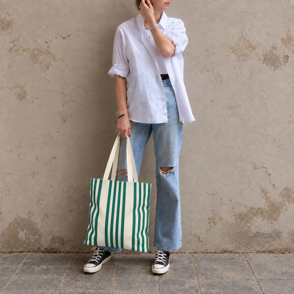 Full-length model photo with the Green Cream Striped tote bag against a wall