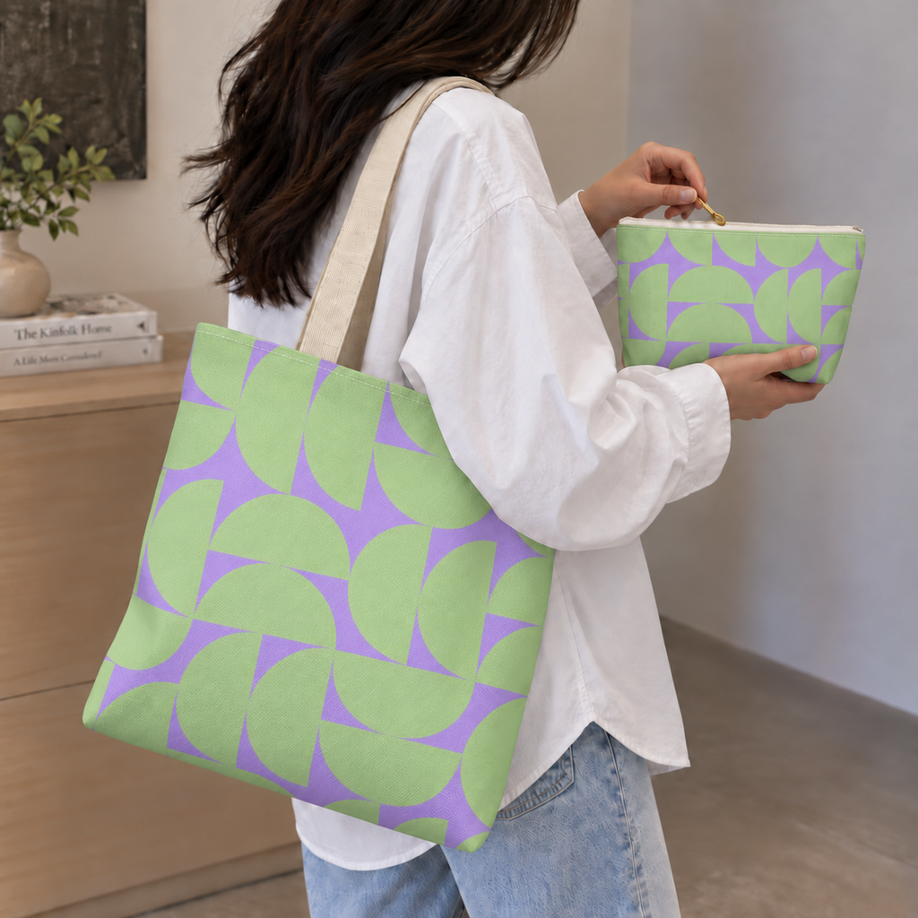 Woman carrying the green lavender half circle tote bag while holding the matching makeup bag