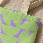 Close-up of the green half circles on lavender with beige handle on the tote bag