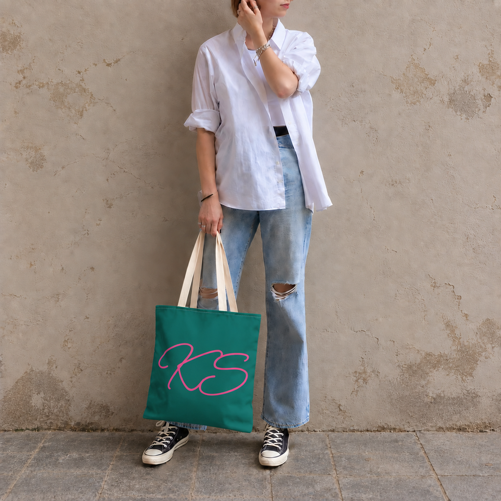 Model standing outdoors with the Green Pink Monogram personalized tote bag in a full-body photo