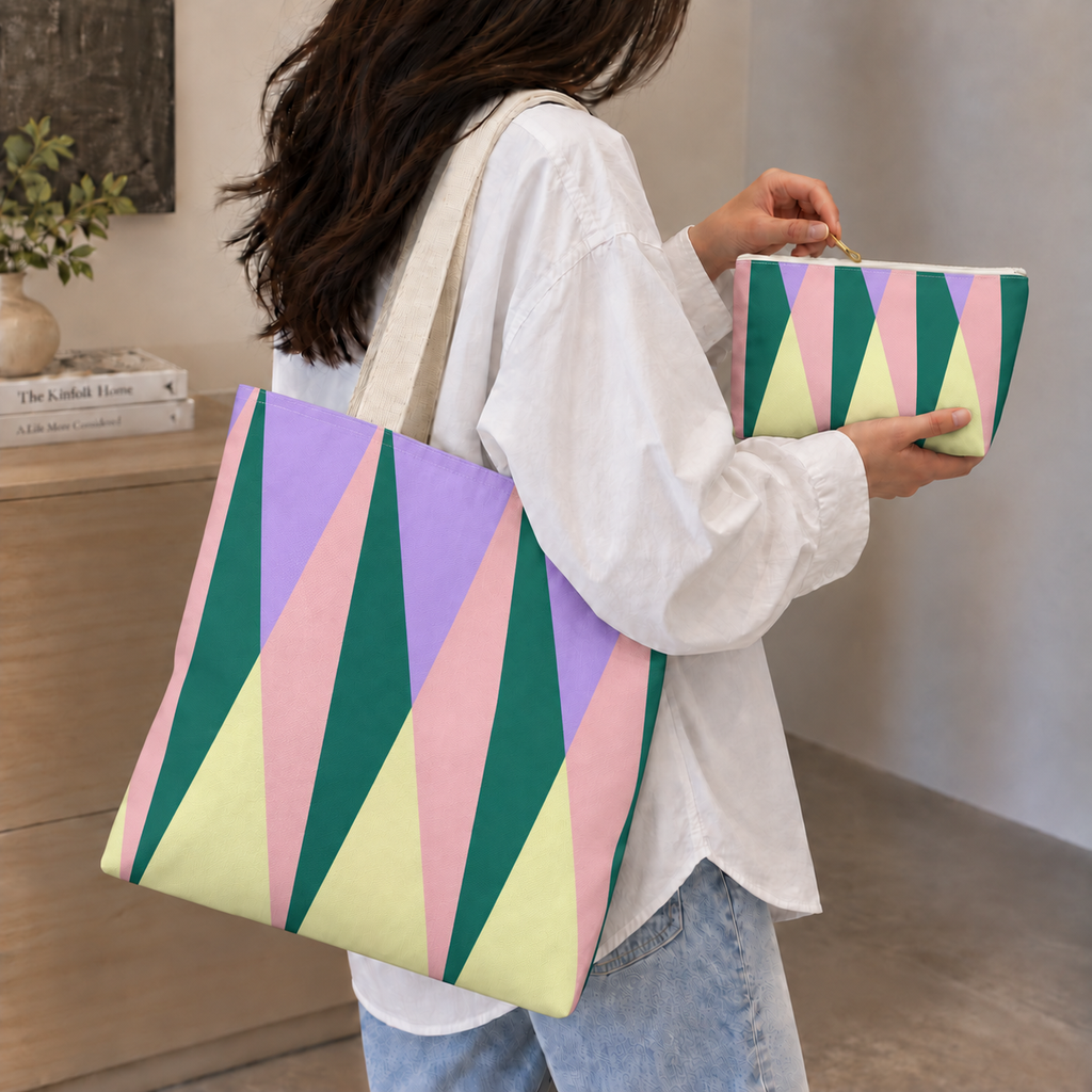 Woman carrying the green pink triangle tote bag with the matching makeup bag