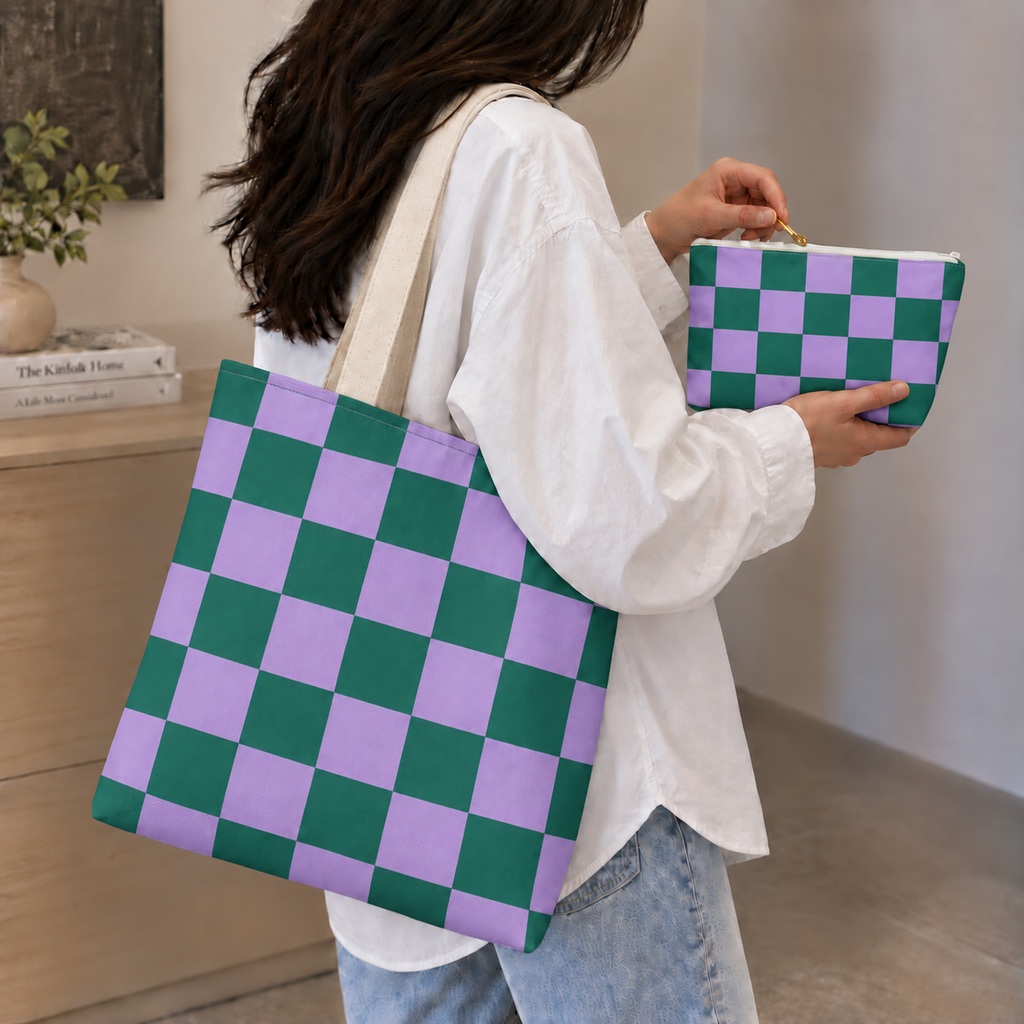 Woman holding the green purple checkered tote bag and matching makeup bag