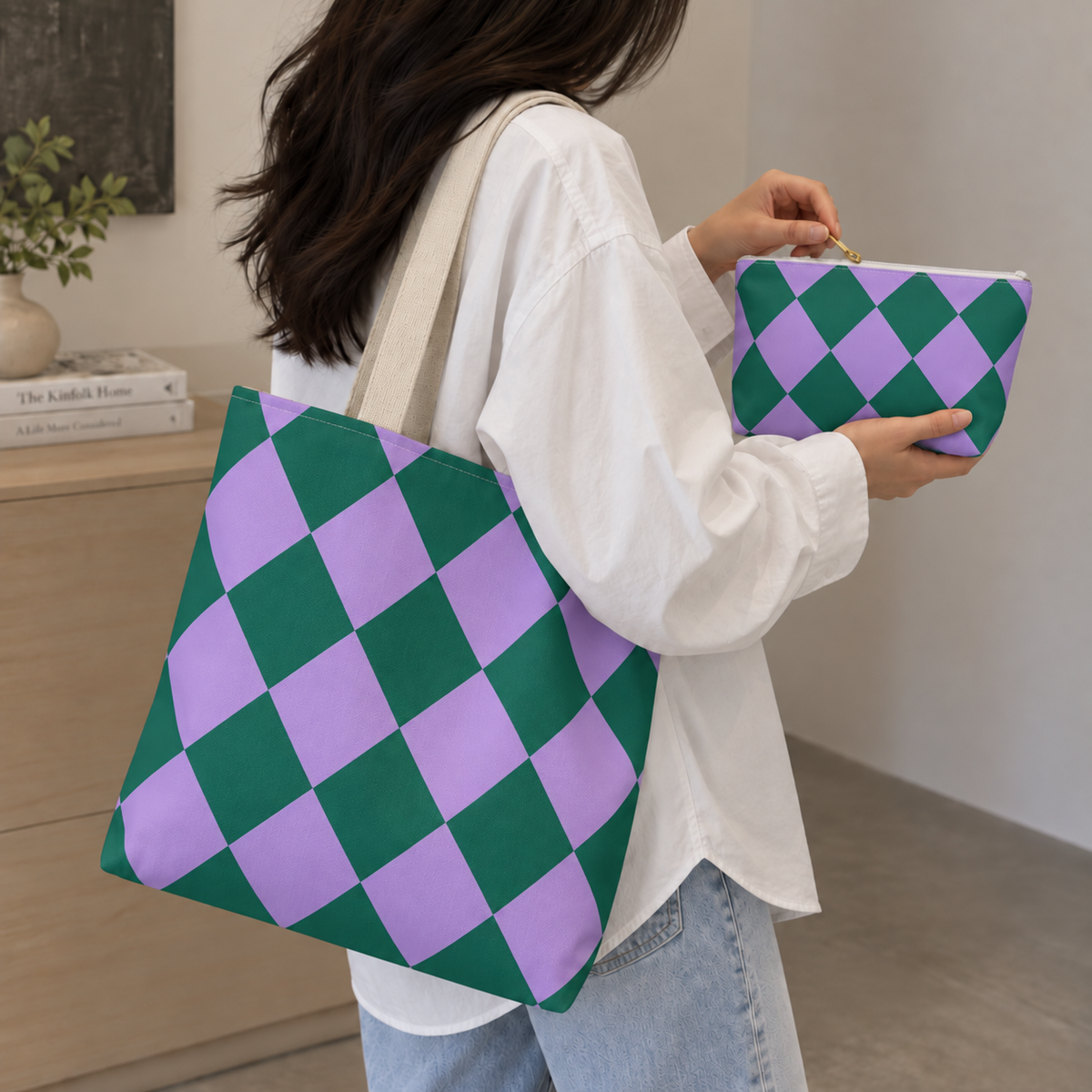 Woman with a checkered tote bag and matching green purple makeup bag in hand
