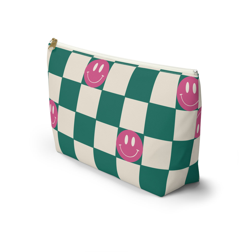 Side view of the green smiley checkered makeup bag with T-shaped bottom