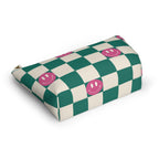 Green smiley checkered makeup bag lying at an angle on a white background