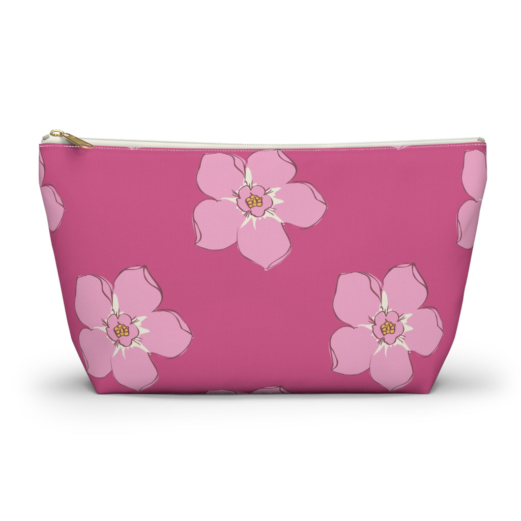 Hot pink blossom floral makeup bag with gold zipper pull, front view on white background