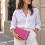 Woman in a white shirt holding the Hot Pink Blue Name personalized makeup bag