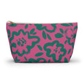 Hot pink makeup bag with green hand-drawn flowers and gold zipper pull on a white background