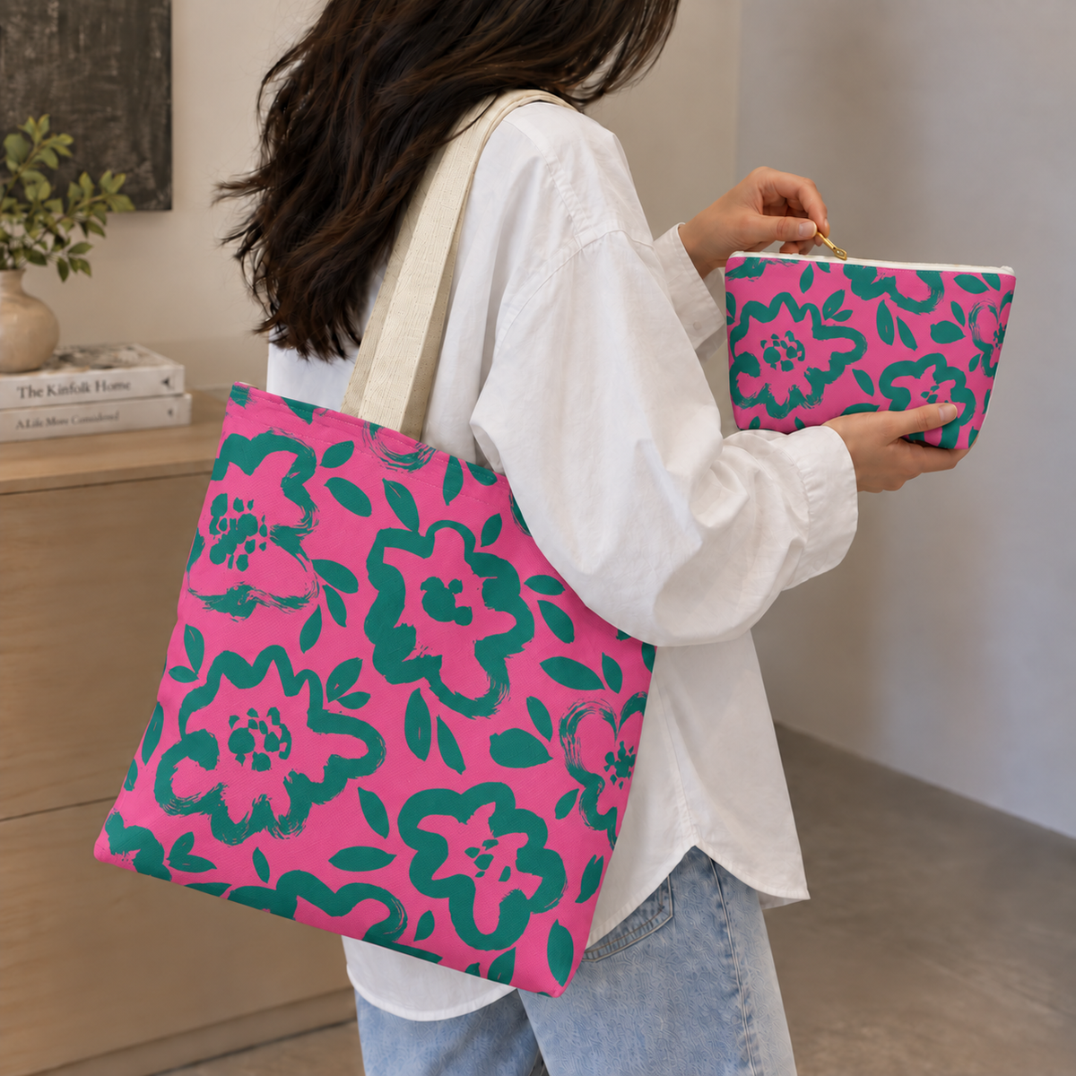 Woman carrying the hot pink green floral tote bag with the matching makeup bag