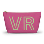 Hot pink personalized makeup bag with pale green outlined VR initials and gold zipper pull on a white background