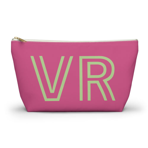 Hot pink personalized makeup bag with pale green outlined VR initials and gold zipper pull on a white background