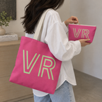 Woman carrying the hot pink personalized tote bag with the matching makeup bag