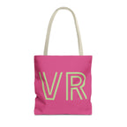 Hot pink personalized tote bag with pale green outlined VR initials and cream handles on a white background