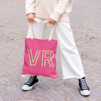 Model holding the hot pink green monogram personalized tote bag by its handles