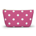 Hot pink polka dot makeup bag with white dots and gold zipper pull, front view