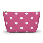 Hot pink polka dot makeup bag with white dots and gold zipper pull, front view