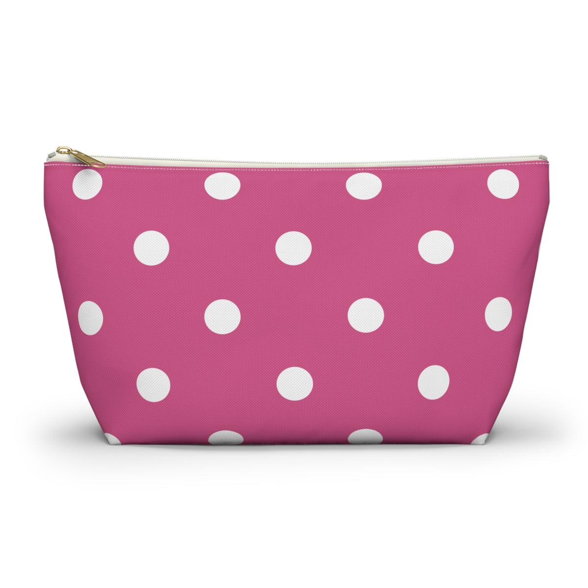 Hot pink polka dot makeup bag with white dots and gold zipper pull, front view
