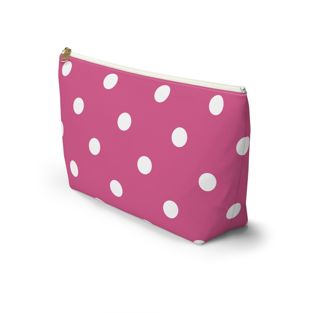 Hot pink polka dot makeup bag with T-shaped bottom seen from the side