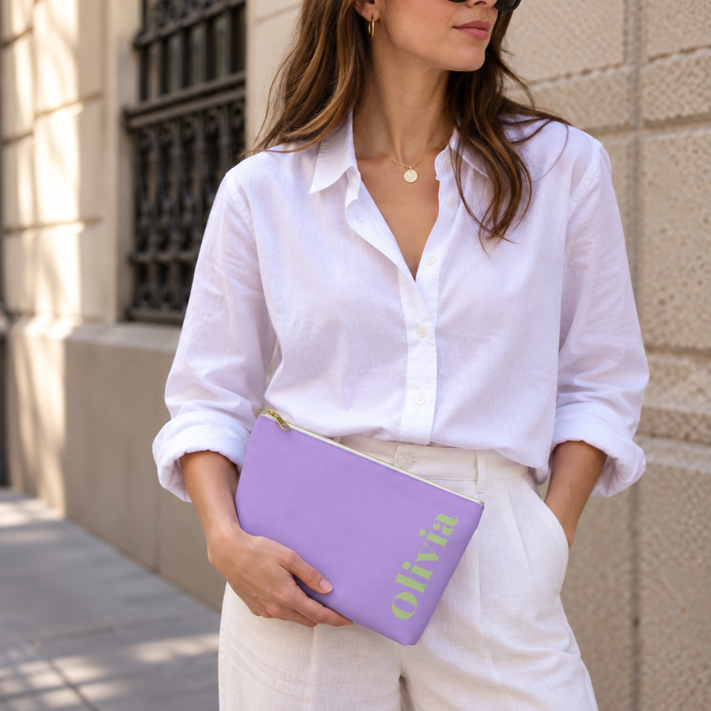 Woman in a white shirt holding the Lavender Green Name personalized makeup bag