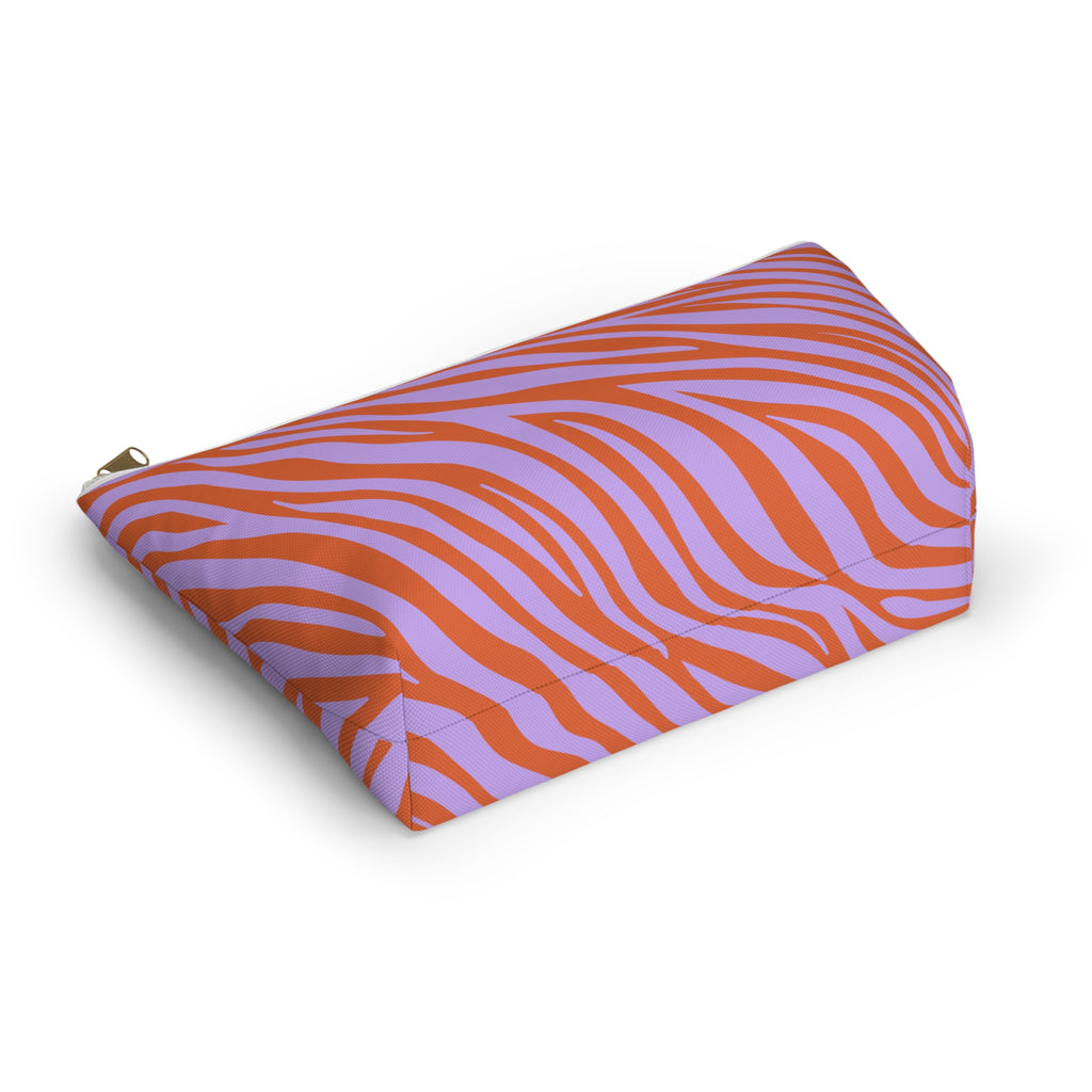 Lavender and orange zebra print cosmetic bag lying on its side