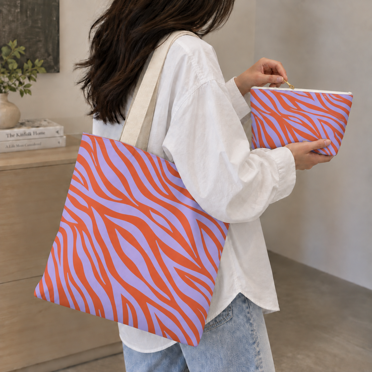 Woman with the zebra print tote bag and matching makeup bag