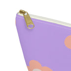 Close-up of the gold zipper pull on the lavender peach daisy makeup bag