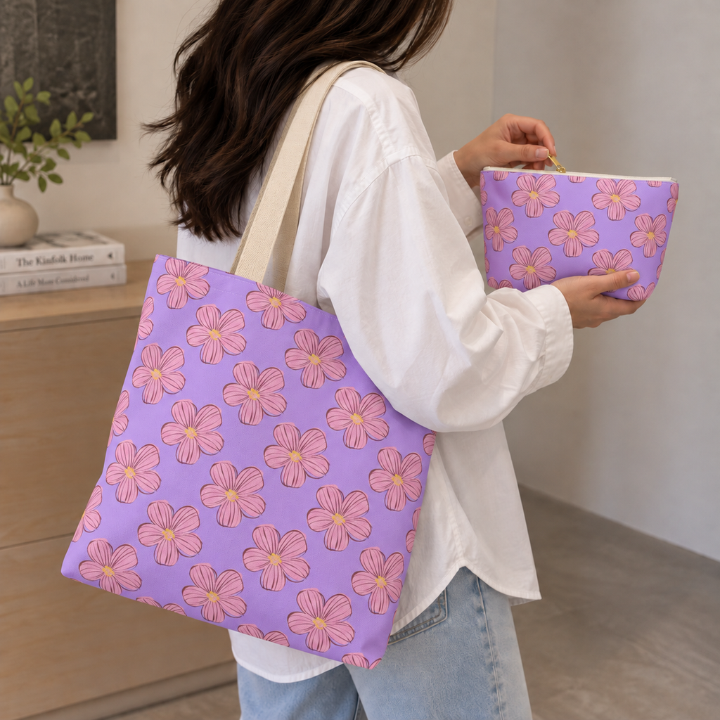 Woman carrying the matching lavender floral tote bag with the makeup bag in her hand
