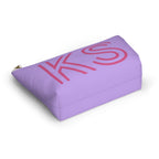 Lavender pink personalized makeup bag lying at an angle on a white background