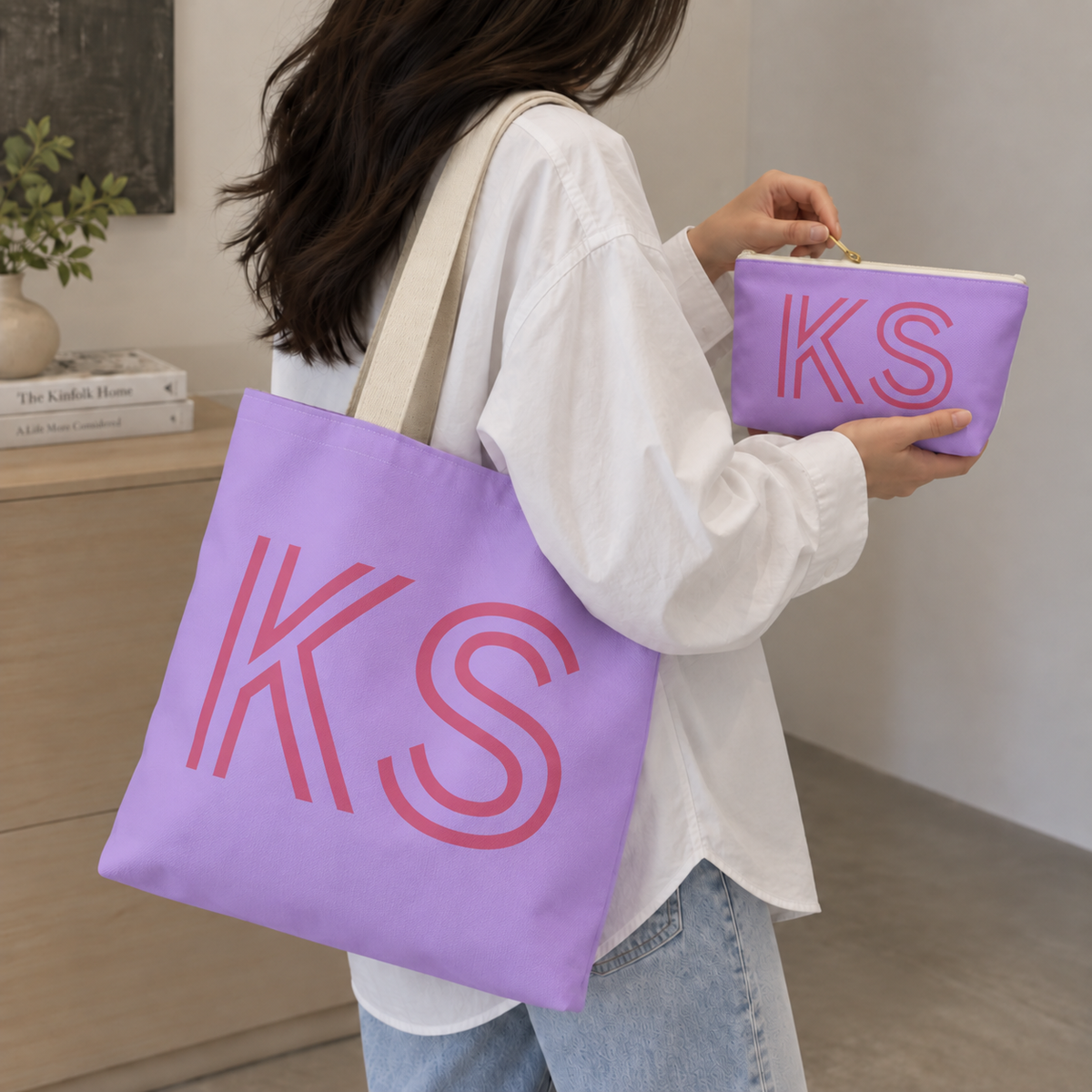 Woman carrying the lavender pink monogram personalized tote bag with the matching makeup bag