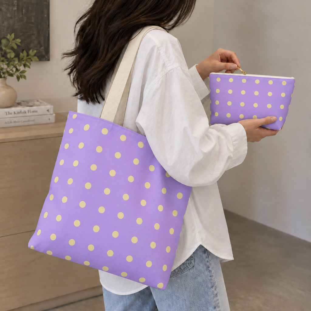 Woman carrying the lavender polka dot tote bag next to the matching makeup bag