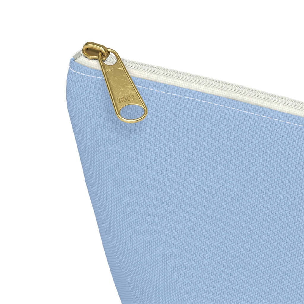 Close-up of the gold zipper pull on the Light Blue Burgundy Name personalized makeup bag