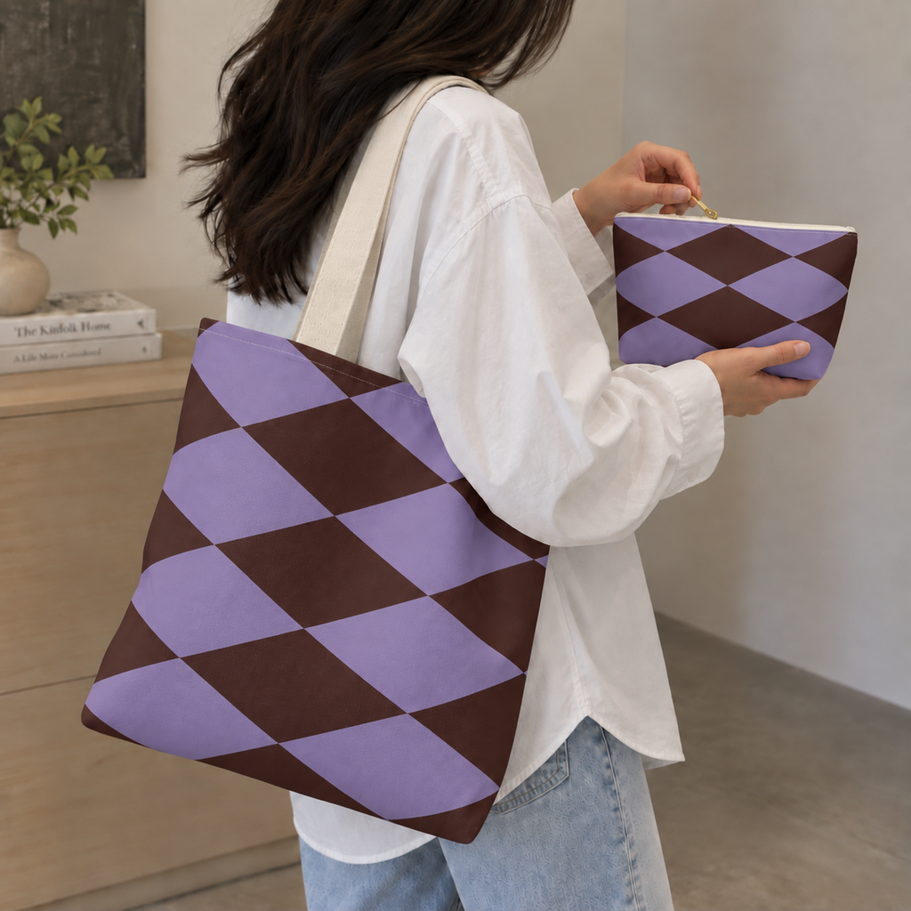 Woman carrying the lilac burgundy diamond tote bag while holding the matching makeup bag