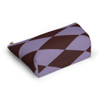 Lilac burgundy diamond makeup bag lying on its side in an angled view