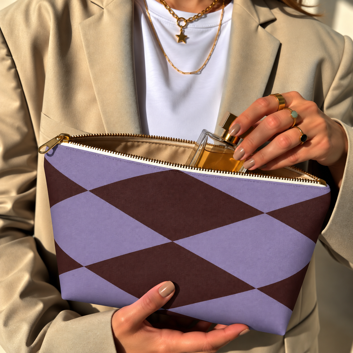 Model in a beige blazer taking a product out of the open lilac burgundy diamond makeup bag