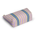 Angled view of the striped makeup bag lying on its side