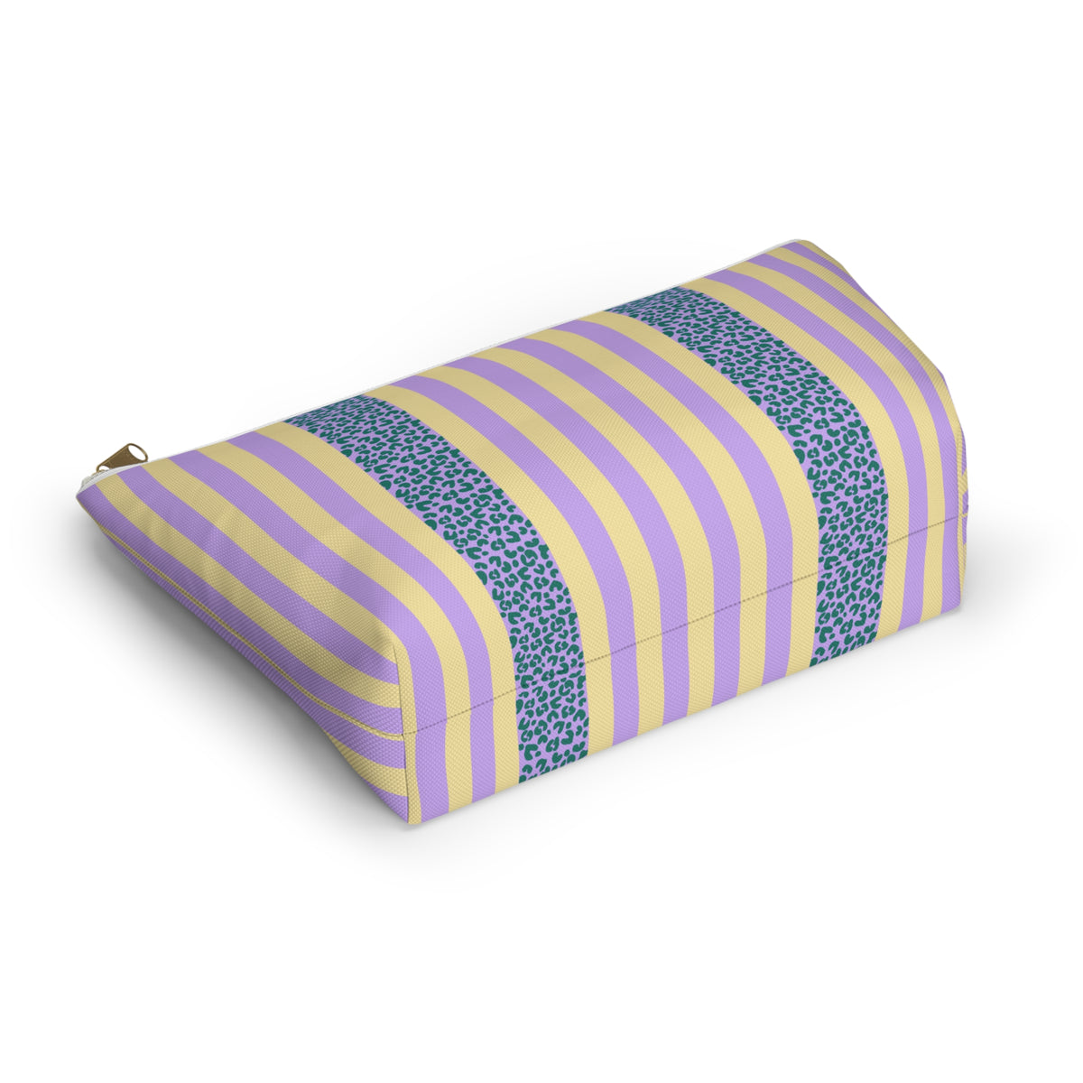 Angled view of the striped makeup bag lying on its side