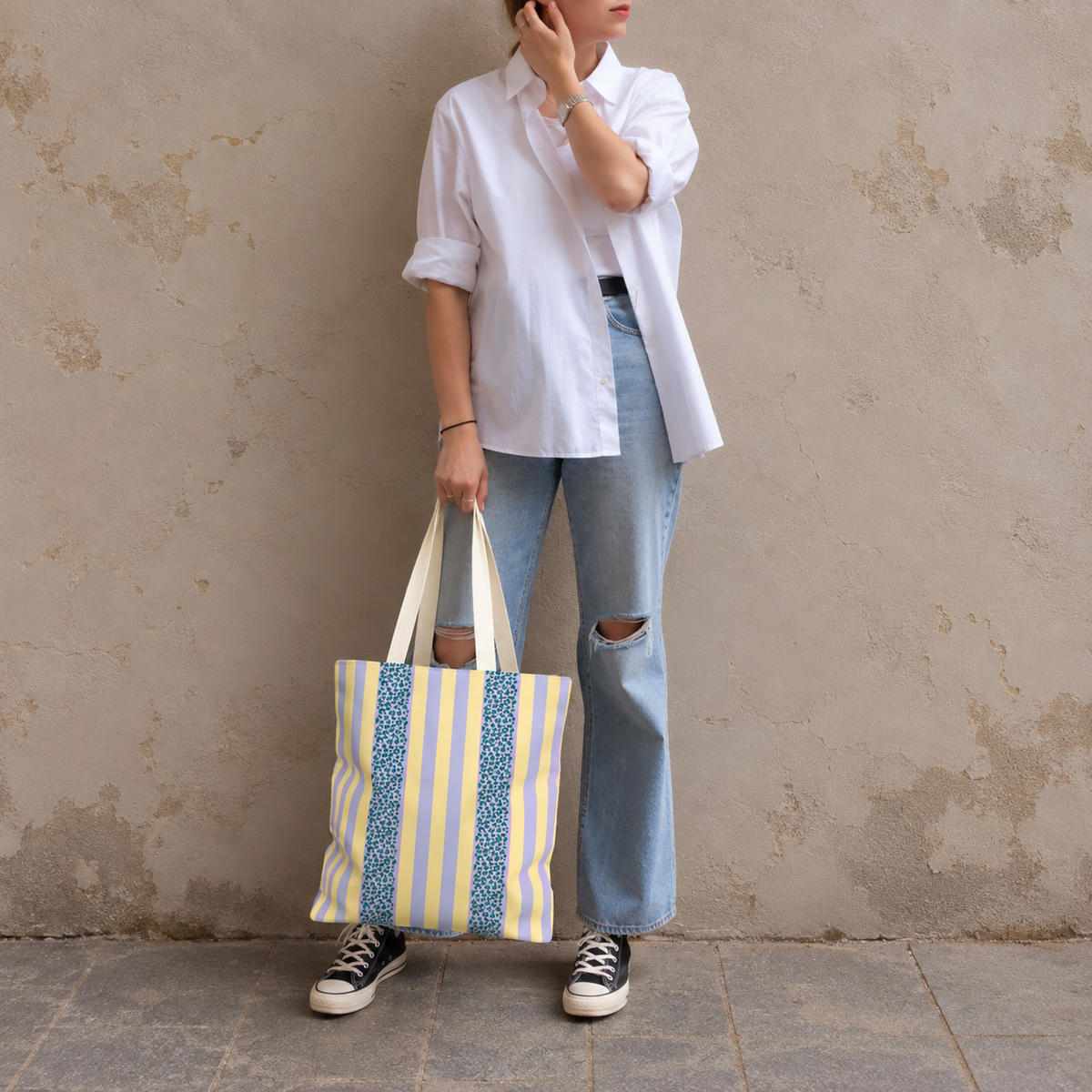 Full-length model photo with the Lilac Leopard Striped tote bag against a wall