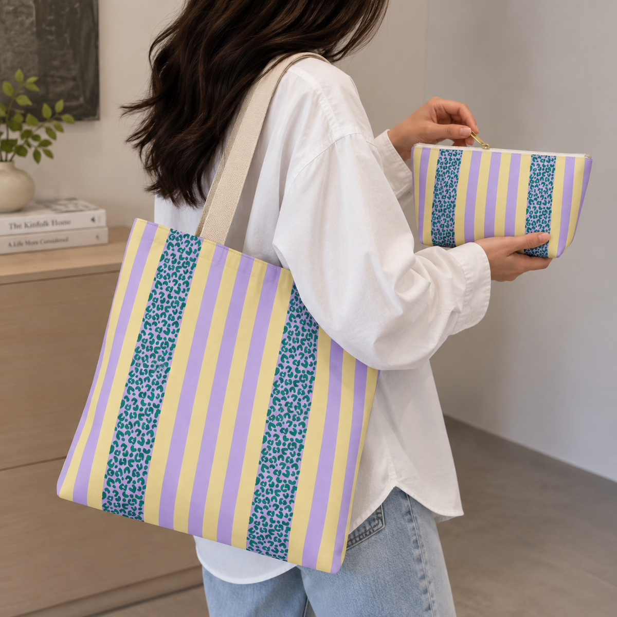 Model holding the Lilac Leopard Striped tote bag with the matching makeup bag