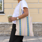 Woman walking with the Lilac Leopard Striped tote bag on her shoulder