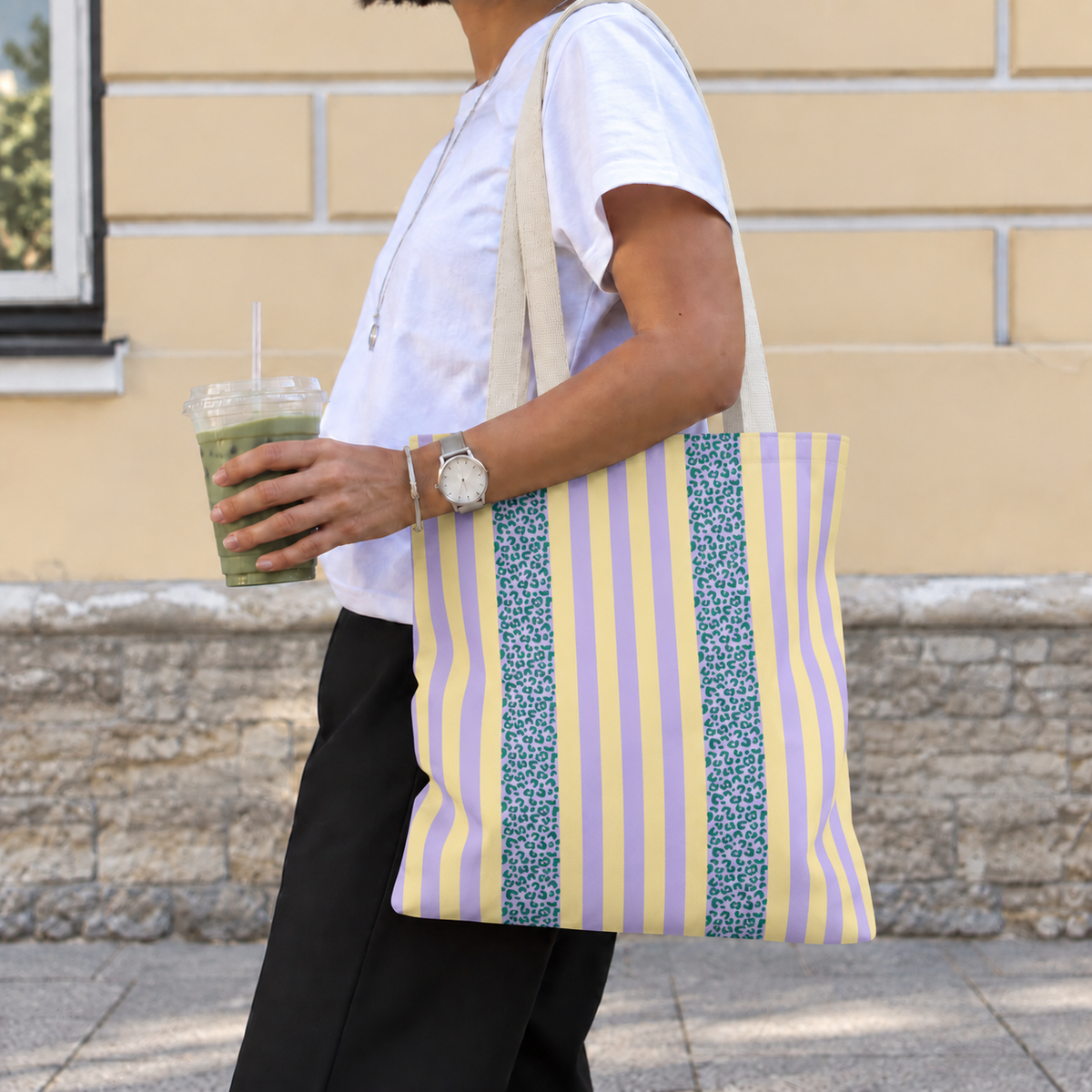 Woman walking with the Lilac Leopard Striped tote bag on her shoulder