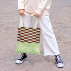 Model with white trousers holding the lime green burgundy checkered personalized tote bag