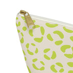 Close-up of the gold zipper pull and lime green leopard spots on the makeup bag