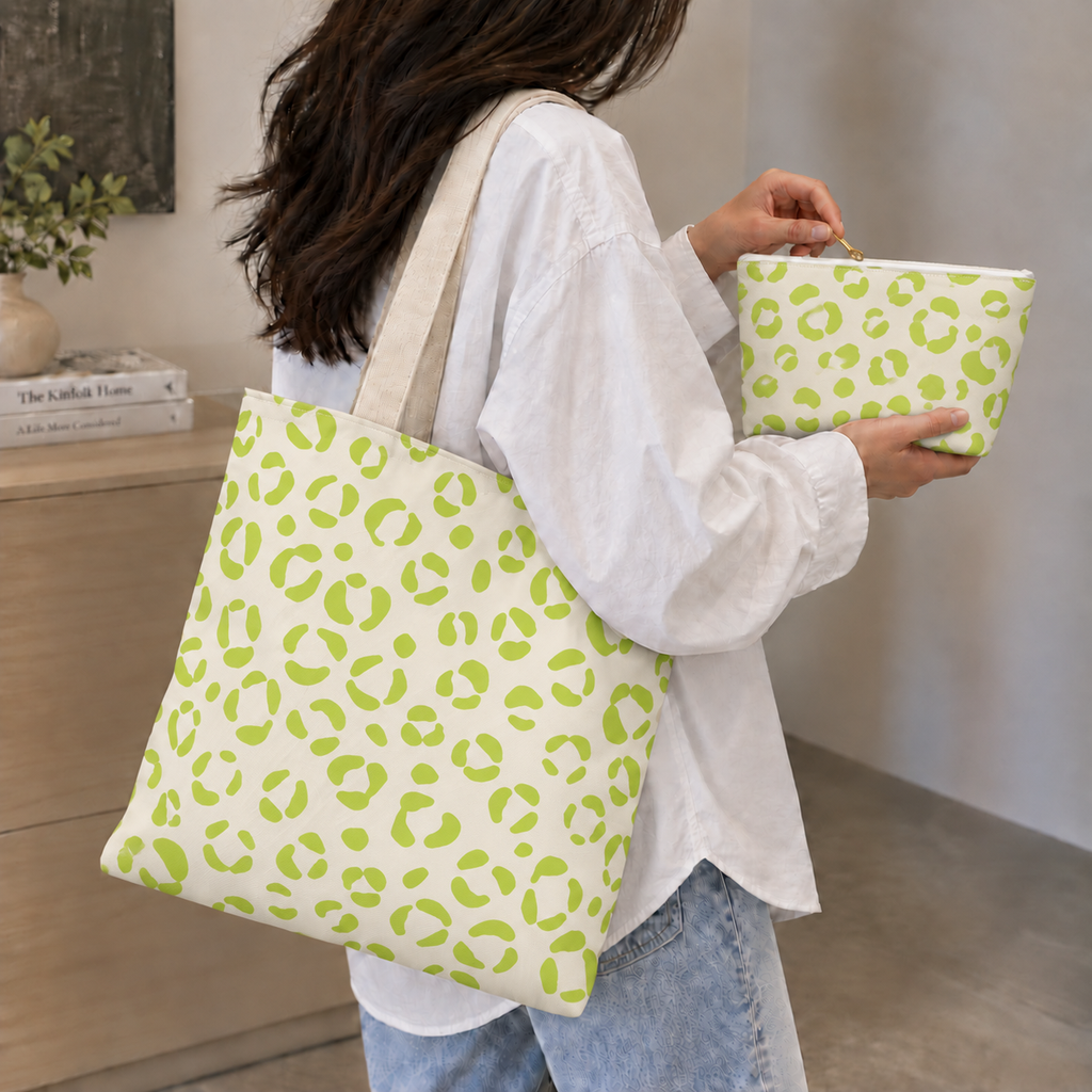 Woman with a leopard print tote bag and matching lime green makeup bag in hand
