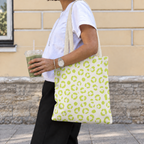 Woman walking with a lime green leopard print tote bag on her shoulder