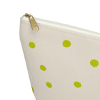 Close-up of the gold zipper pull and green dots on the makeup bag