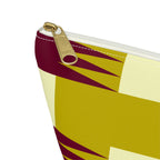 Close-up of the gold zipper pull and jagged burgundy geometric print on the makeup bag