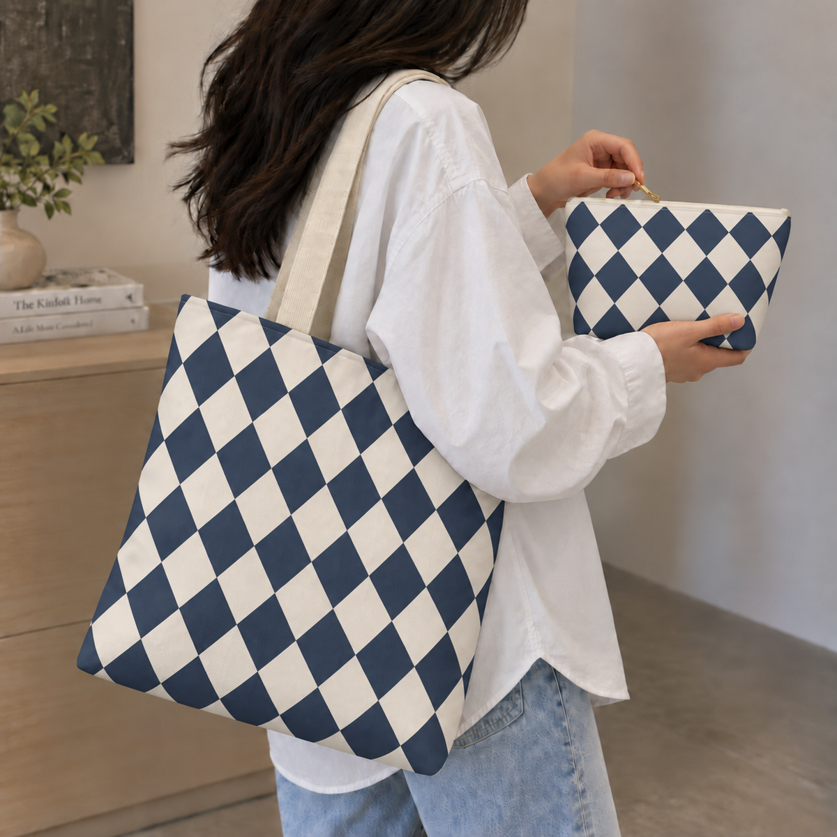 Navy diamond checkered tote bag on the shoulder with the matching makeup bag
