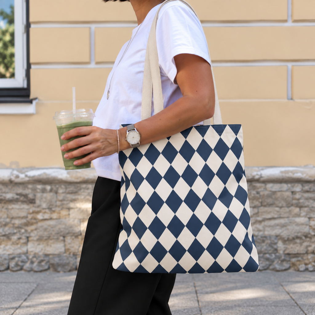 Woman walking with a navy cream diamond checkered tote bag over her shoulder