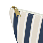 Close-up of the gold zipper pull and navy stripe on the makeup bag
